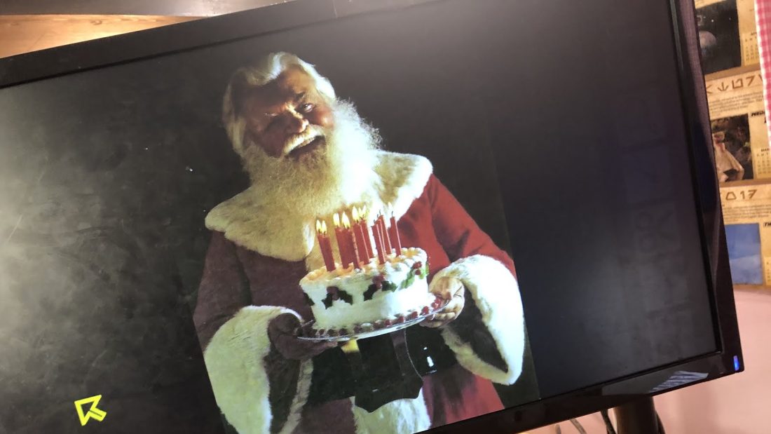 Santa holding a birthday cake for me