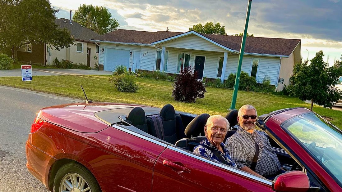 Grandpa and Opa in the red convertible